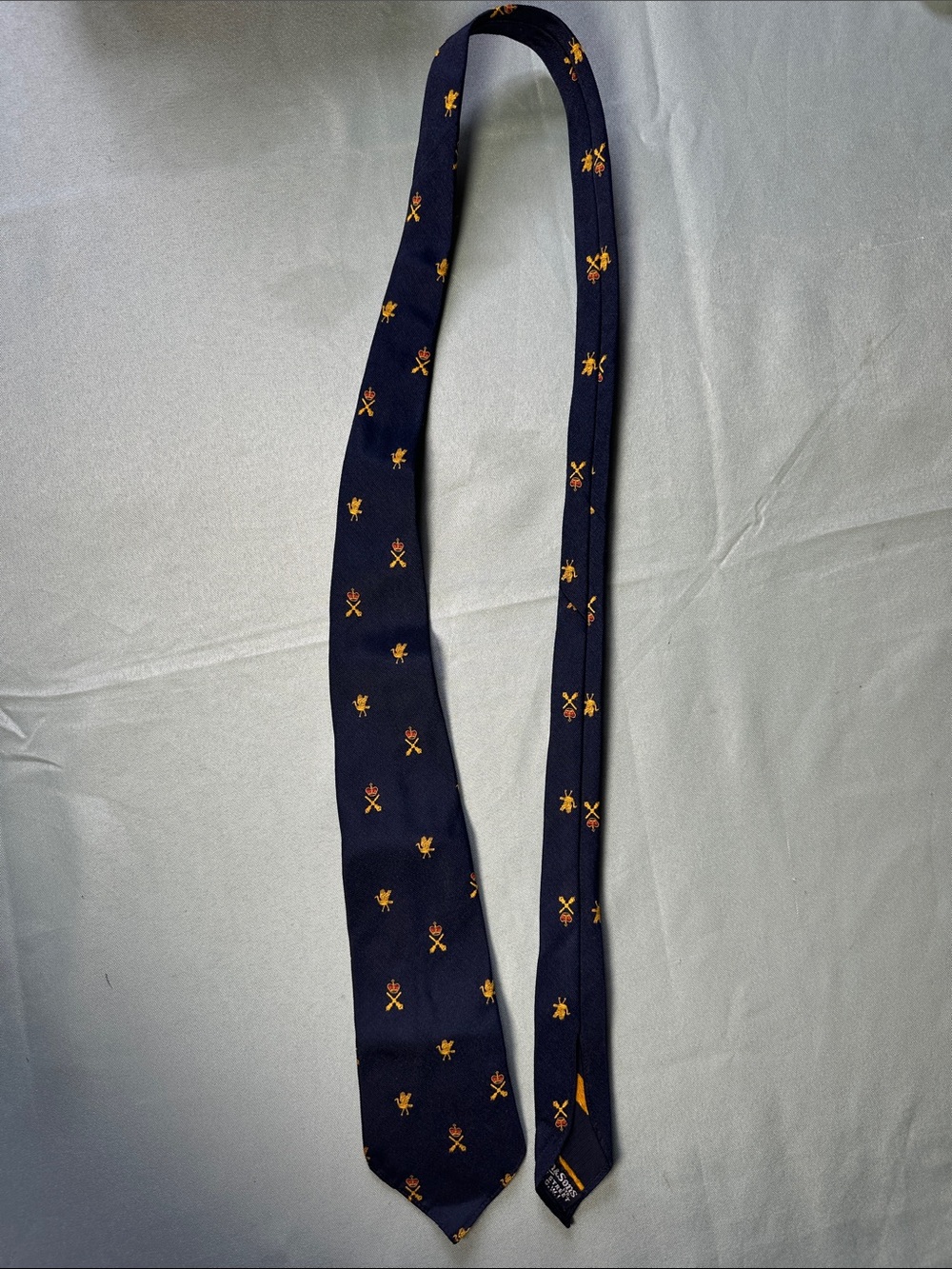 Men's Navy Blue Tie with Small Gold Crest Pattern